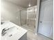 Bathroom with double sink vanity and tile shower at 1227 Fern Ridge Ct # 17, Norcross, GA 30093