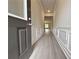 View of the entryway with hardwood floors, molding details, and neutral paint at 1227 Fern Ridge Ct # 17, Norcross, GA 30093