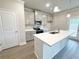 Stylish kitchen with white countertops, gray cabinets, and stainless steel appliances at 1227 Fern Ridge Ct # 17, Norcross, GA 30093