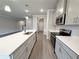 Open kitchen design with a large island, stainless steel appliances, and ample cabinet space at 1227 Fern Ridge Ct # 17, Norcross, GA 30093