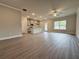 An open-concept floor plan featuring kitchen with gray cabinets and stainless appliances at 1227 Fern Ridge Ct # 17, Norcross, GA 30093