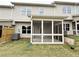 Exterior view of the screened in porch with a view of a level, fenced backyard at 1227 Fern Ridge Ct # 17, Norcross, GA 30093