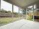 Enjoy outdoor living in this screened porch with views of the backyard and privacy fence at 1227 Fern Ridge Ct # 17, Norcross, GA 30093