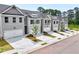Rows of two-story homes with garages and small lawns add to the neighborhood's appeal at 1237 Fern Ridge Ct # 18, Norcross, GA 30093