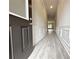 Inviting entryway with wood-look floors, decorative trim and recessed lighting at 1237 Fern Ridge Ct # 18, Norcross, GA 30093