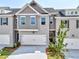 Beautiful two-story home featuring a two-car garage, brickwork and grey siding at 1237 Fern Ridge Ct # 18, Norcross, GA 30093