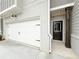 A two-car garage and covered entryway give easy access to this well-kept home at 1237 Fern Ridge Ct # 18, Norcross, GA 30093