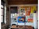 A dining space with a gallery wall, exposed brick and large industrial windows at 170 Boulevard Se # H414, Atlanta, GA 30312