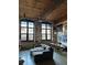 Spacious living room featuring exposed brick, large windows, and an open floor plan at 170 Boulevard Se # H414, Atlanta, GA 30312