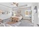 Bedroom with tray ceiling, ceiling fan, and large windows at 173 Bramlett Ridge Dr, Dallas, GA 30157