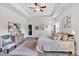 Bright bedroom with a tray ceiling, fan, and decorative accents at 173 Bramlett Ridge Dr, Dallas, GA 30157