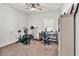 A spacious home gym with exercise equipment and a ceiling fan at 173 Bramlett Ridge Dr, Dallas, GA 30157