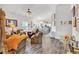 Bright living room featuring hardwood floors, comfortable seating, and a view into the open-concept kitchen at 173 Bramlett Ridge Dr, Dallas, GA 30157