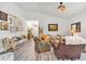 Spacious living room featuring hardwood floors, comfortable seating, and tastefully decorated walls at 173 Bramlett Ridge Dr, Dallas, GA 30157
