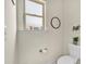 Toilet and window in bathroom with a small decor shelf above the toilet at 173 Bramlett Ridge Dr, Dallas, GA 30157