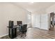 Bedroom featuring wood-look floors, a desk, and two closets, providing ample storage at 1602 Dover Creek Ln, Lawrenceville, GA 30045