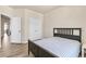Bright bedroom with a bed and doors to closets and an adjacent space at 1602 Dover Creek Ln, Lawrenceville, GA 30045