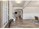 Elegant foyer featuring hardwood floors, wainscoting, and an open view to the living and dining areas at 1602 Dover Creek Ln, Lawrenceville, GA 30045