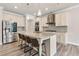 Bright kitchen features stainless steel appliances, granite counters and a large island with bar stool seating at 1602 Dover Creek Ln, Lawrenceville, GA 30045