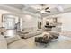 Open-concept living room and kitchen area with modern furnishings and lots of natural light at 1602 Dover Creek Ln, Lawrenceville, GA 30045