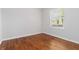 Bedroom featuring a bright window and hardwood floors at 1907 Clarke Ln, Decatur, GA 30035