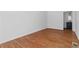 Bedroom featuring hardwood floors and an attached bathroom at 1907 Clarke Ln, Decatur, GA 30035