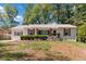 Charming single-story home featuring a cozy porch and red shutters at 1907 Clarke Ln, Decatur, GA 30035