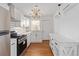 Bright kitchen with stainless steel appliances, ample counter space, and modern lighting at 1907 Clarke Ln, Decatur, GA 30035