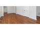 Spacious living area featuring beautiful hardwood floors and neutral-toned walls at 1907 Clarke Ln, Decatur, GA 30035