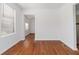 Bright living room featuring beautiful hardwood floors and a large window for natural light at 1907 Clarke Ln, Decatur, GA 30035