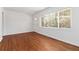 Inviting living room featuring gleaming hardwood floors and a sunlit window at 1907 Clarke Ln, Decatur, GA 30035