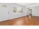 Bright living room with hardwood floors and a large window overlooking the neighborhood at 1907 Clarke Ln, Decatur, GA 30035