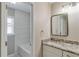 Stylish bathroom featuring tub, shower, vanity with granite countertop, and modern fixtures at 351 Chandler Bluff Ct, Grayson, GA 30017