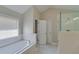 Bright bathroom with a soaking tub and tiled shower at 351 Chandler Bluff Ct, Grayson, GA 30017