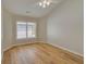 Inviting bedroom with wood floors, a ceiling fan, and a bright window at 351 Chandler Bluff Ct, Grayson, GA 30017