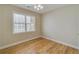 Comfortable bedroom with wood flooring, neutral walls and a ceiling fan at 351 Chandler Bluff Ct, Grayson, GA 30017
