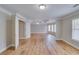 Large bedroom with tray ceiling, hardwood floors, and large windows at 351 Chandler Bluff Ct, Grayson, GA 30017