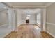 Spacious dining room featuring hardwood floors, wainscoting, and an elegant chandelier at 351 Chandler Bluff Ct, Grayson, GA 30017