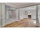 Open dining room with hardwood floors, wainscoting, and views into the kitchen at 351 Chandler Bluff Ct, Grayson, GA 30017