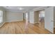 Large hallway with wood floors leading to bedrooms and bathrooms at 351 Chandler Bluff Ct, Grayson, GA 30017