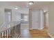 Bright hallway with wood floors leads to living areas at 351 Chandler Bluff Ct, Grayson, GA 30017