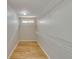 Spacious walk-in closet with wooden floors and wire shelving at 351 Chandler Bluff Ct, Grayson, GA 30017