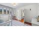 Shared bedroom with bunk beds, wood floors, and open bathroom and closet at 3562 Sunderland Ne Cir, Atlanta, GA 30319