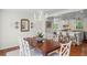 Bright dining room with hardwood floors adjacent to an open kitchen with stainless steel appliances at 3562 Sunderland Ne Cir, Atlanta, GA 30319