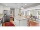 Open kitchen showcases a large island with seating and views into the adjacent dining area at 3562 Sunderland Ne Cir, Atlanta, GA 30319