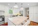 Bright kitchen featuring a large island with marble countertops and stainless steel appliances at 3562 Sunderland Ne Cir, Atlanta, GA 30319