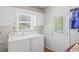 Functional laundry room with a washer, dryer, and natural light at 3562 Sunderland Ne Cir, Atlanta, GA 30319