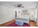 Well-lit main bedroom with a ceiling fan, hardwood floors, and a walk-in closet at 3562 Sunderland Ne Cir, Atlanta, GA 30319