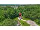 An aerial view of the residence nestled among mature trees in a quiet, established neighborhood at 3927 Villager Way, Rex, GA 30273