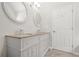 Bright bathroom features double sink vanity with granite countertop and modern fixtures at 3927 Villager Way, Rex, GA 30273